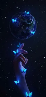 Hand with blue butterflies near earth, starry night sky.