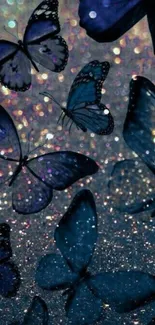 Blue butterflies hovering over a glittering bokeh background.