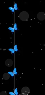 Blue butterflies on a sleek black background wallpaper.