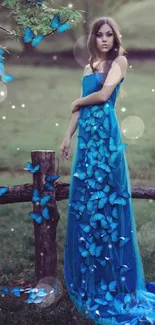 Woman in blue dress with butterflies in a natural setting.