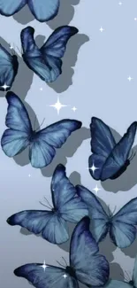 Blue butterflies wallpaper with gentle shadows on a light blue background.