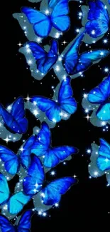 Luminous blue butterflies on a dark background with sparkling stars.