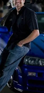 A person leaning on a blue sports car with nighttime vibes.