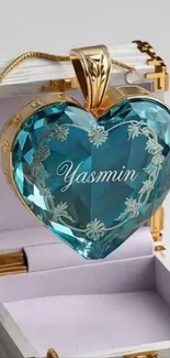 Blue crystal heart pendant with gold detailing.