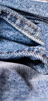 Close-up of blue denim fabric texture.