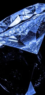 A stunning blue diamond with a reflective surface on a black background.