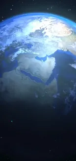 A stunning view of Earth from space with brilliant blue tones against a starry background.