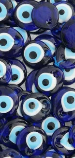 Blue evil eye charms wallpaper for mobile devices.