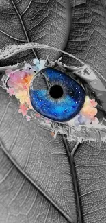 An artistic blue eye set on a detailed leaf background with colorful accents.