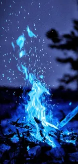 Mobile wallpaper with glowing blue flames at night.