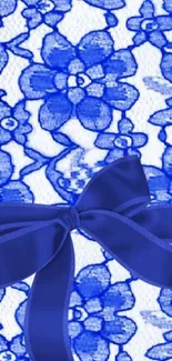 Elegant blue floral wallpaper with bow design.