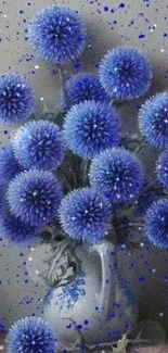 Elegant blue flowers in a decorative vase against a dotted backdrop.