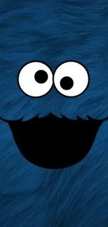 Blue furry wallpaper with a smiling cartoon face and large eyes.