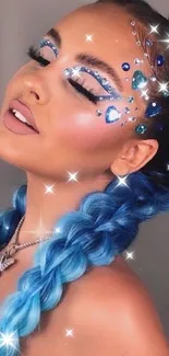 Artistic blue hair and makeup with sparkling gemstones.