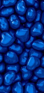 Vibrant blue heart-shaped candy wallpaper featuring glossy texture.