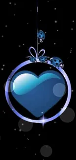 Blue heart ornament with ladybugs on black background wallpaper.