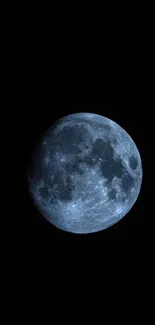 Blue moon against a dark sky wallpaper.