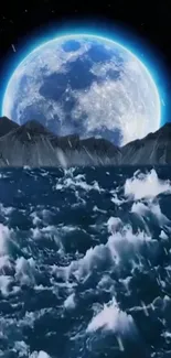 Blue moon shines over a dark ocean and majestic mountains at night.