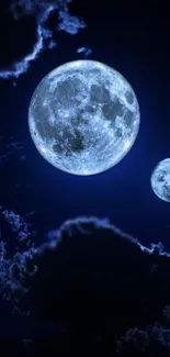 Beautiful blue moon and clouds in night sky wallpaper.