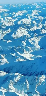 Aerial view of blue snowy mountains.