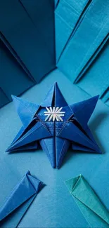Intricate blue origami star on paper folds.