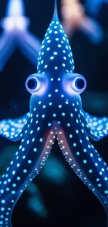 Vibrant blue octopus with polka dots on a dark background.