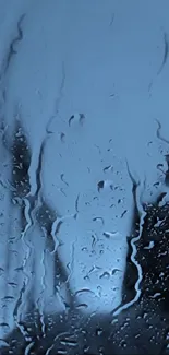 Calming blue raindrop glass wallpaper with abstract wet effects.