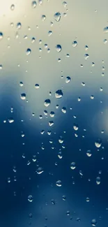 Serene blue raindrop mobile wallpaper with water droplets on glass.