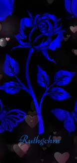 Blue rose with butterflies on dark backdrop.