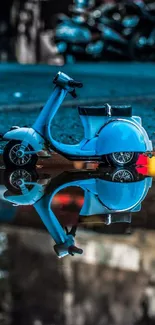 Blue scooter with reflection in puddle against urban backdrop.