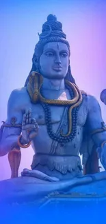 Serene Lord Shiva statue in blue tones.