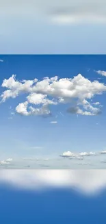 Serene blue sky with fluffy white clouds.