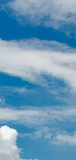 Mobile wallpaper of blue sky with fluffy white clouds.