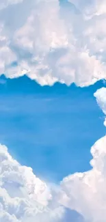 Heart-shaped cloud opening to blue sky in mobile wallpaper.