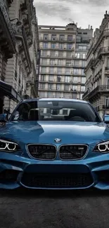 Blue car in urban city street with historic buildings.