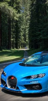 Blue sports car on forest road with tall trees.