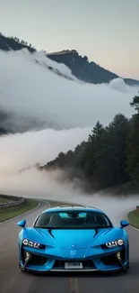 Blue sports car on a misty mountain road.