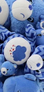 Blue teddy bear wallpaper with plush toys.