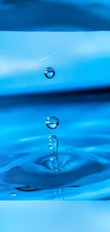 Vibrant blue water droplet on calm surface.