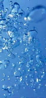 Blue water droplets creating a refreshing phone wallpaper.