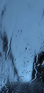 Blue water droplets create a calming phone wallpaper.