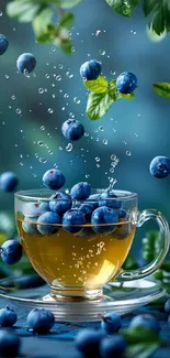 Fresh blueberries splashing into tea cup