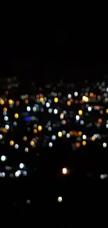 Blurry city lights at night in a bokeh style on a dark wallpaper.