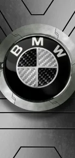 BMW logo on a metallic gray background with geometric patterns.