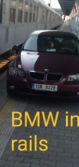 BMW car parked beside train at station showing urban vibe.