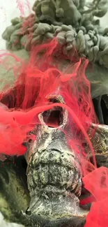 Artistic skull with red smoke on your phone wallpaper.