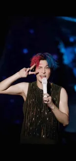 Concert performer with colorful hair on stage.