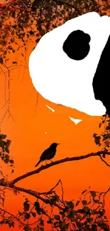 Silhouette of crow on a vibrant orange background with artistic contrast.