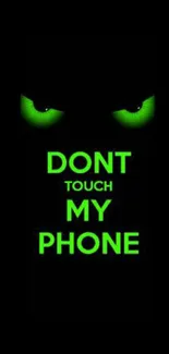 Green eyes with 'Don't Touch My Phone' message on black background.