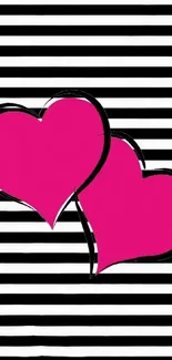 Fuchsia hearts on striped black and white background.